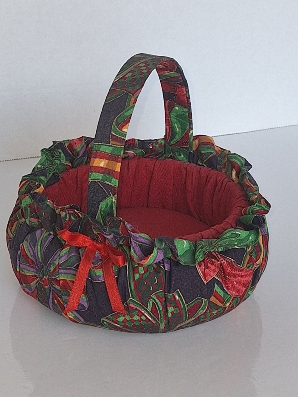 A Round Handmade Fabric Basket Handle Red Interior Colorful Exterior